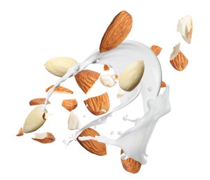 Image of Delicious almond milk and nuts on white background