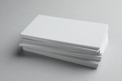 Photo of Blank business cards on light gray background, closeup. Mockup for design