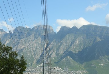 Picturesque view of big mountains near city