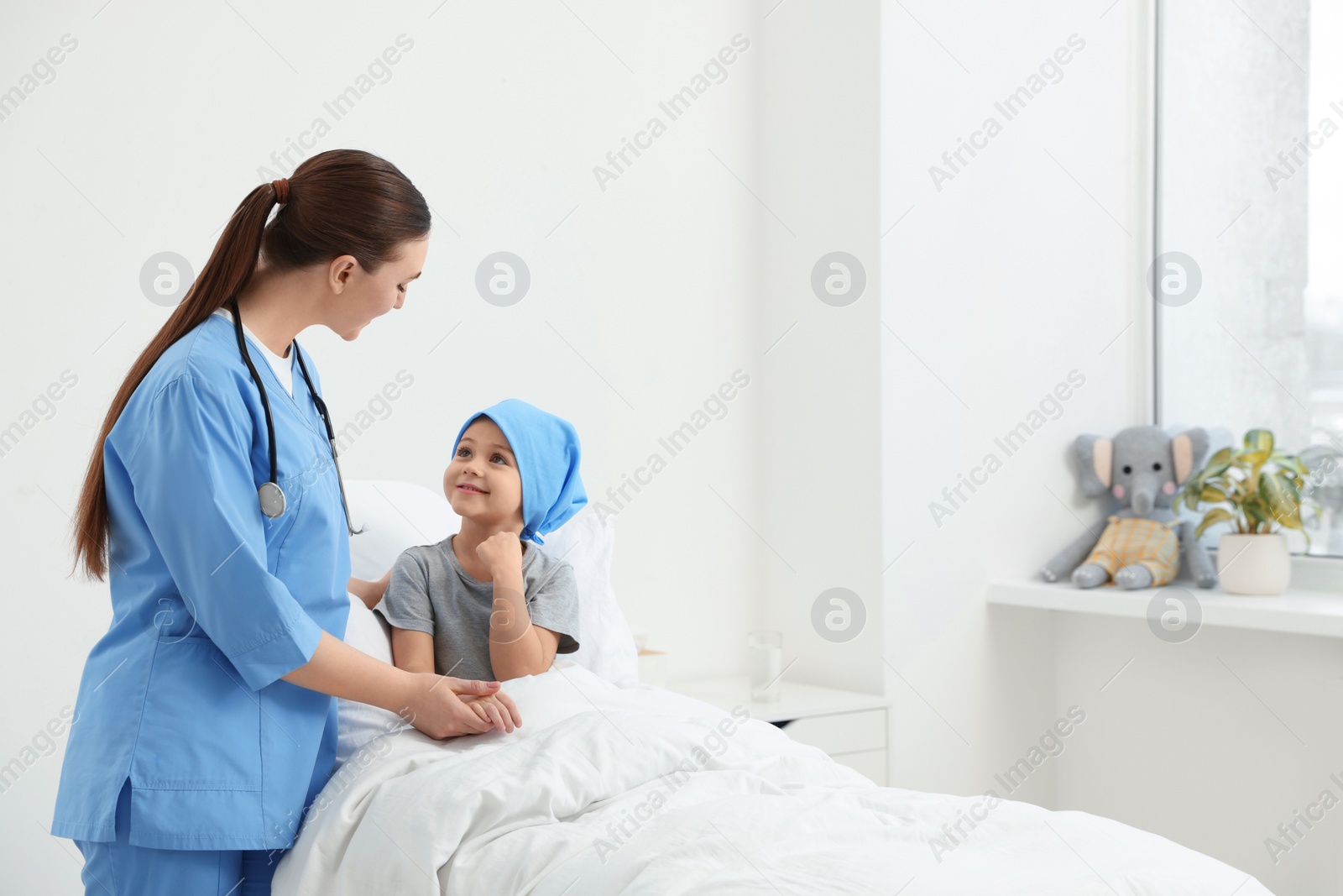 Photo of Childhood cancer. Doctor and little patient in hospital