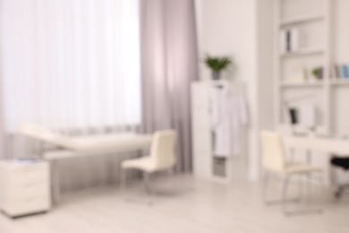 Blurred view of medical office interior with doctor's workplace