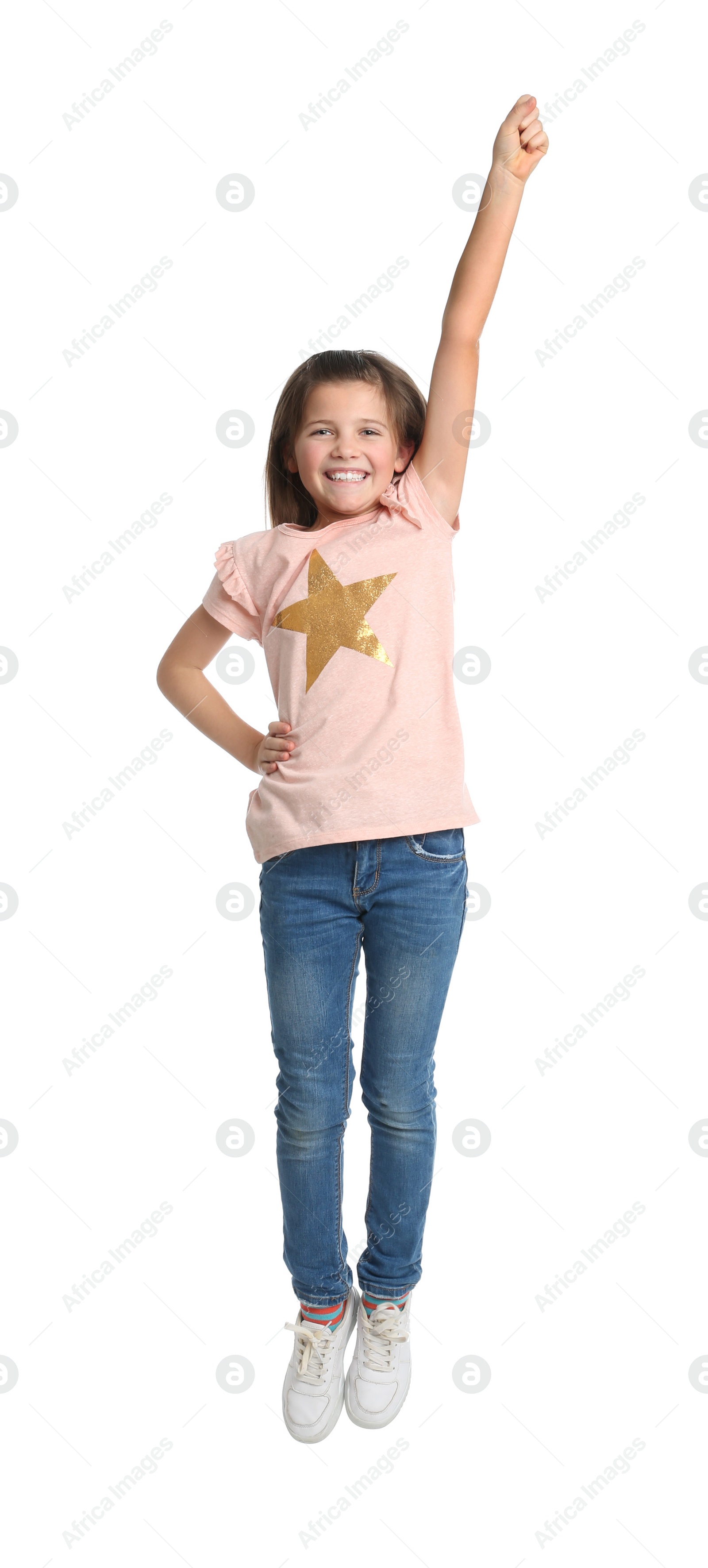 Photo of Full length portrait of preteen girl jumping on white background