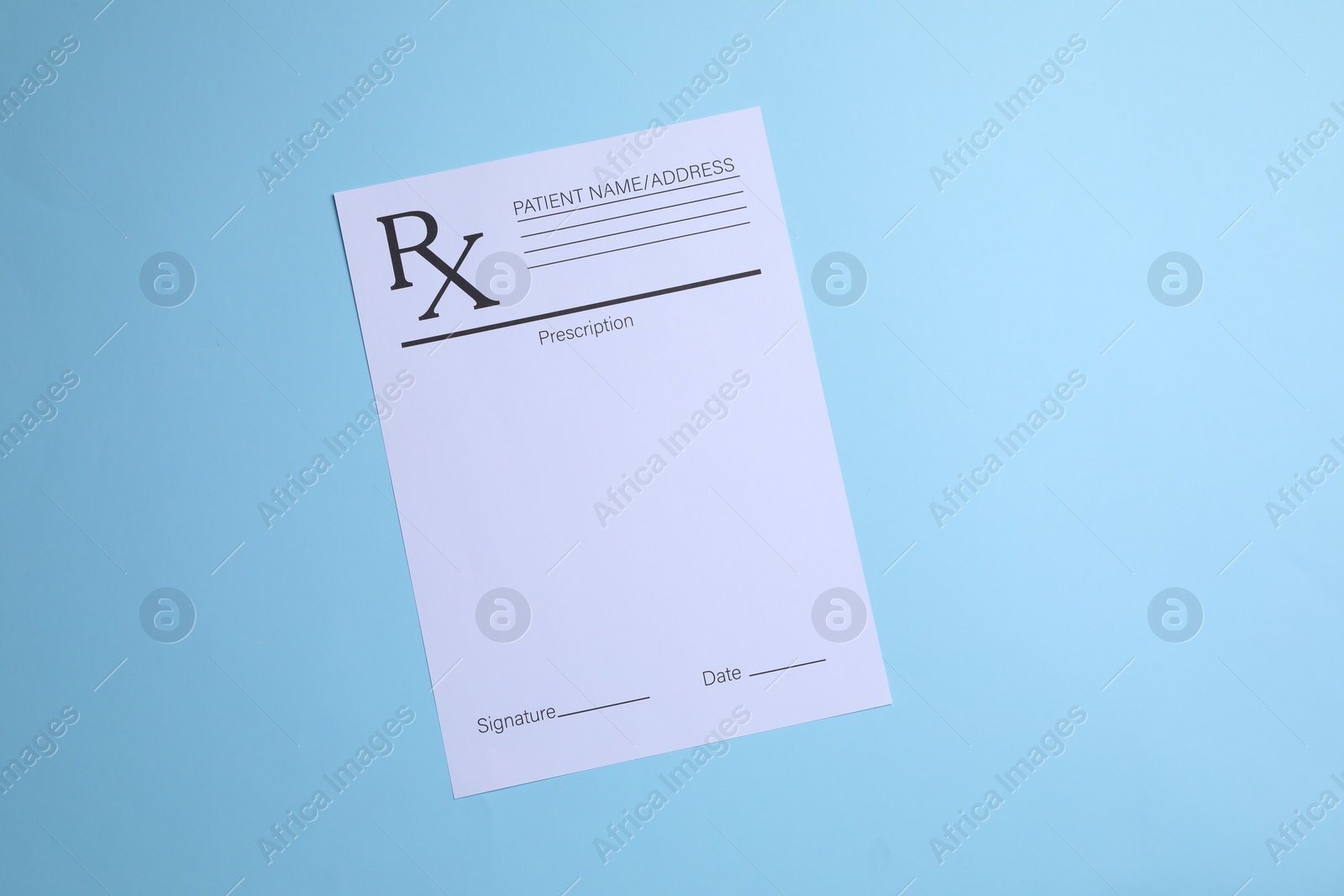 Photo of Medical prescription form on light blue background, top view