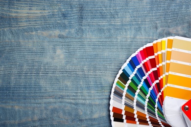 Photo of Color palette samples on wooden background