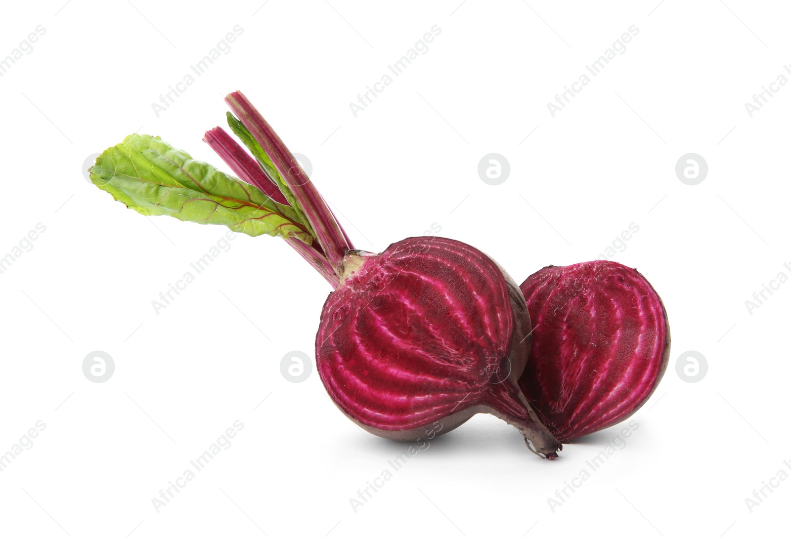 Photo of Halves of fresh beet with leaves on white background