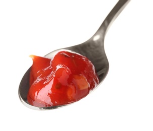 Photo of Metal spoon with red sauce on white background