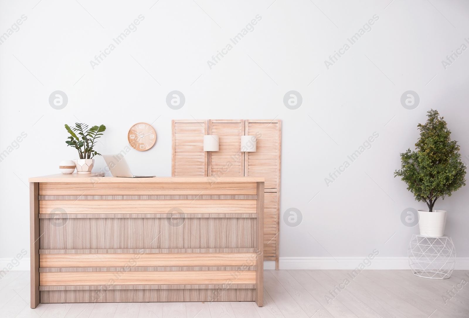 Photo of Hotel lobby interior with wooden reception desk