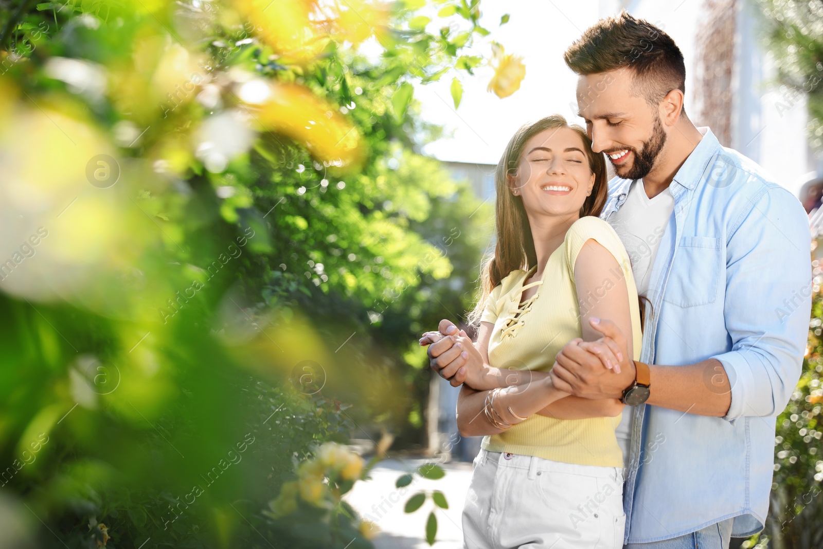 Photo of Lovely young couple dancing together in park on sunny day