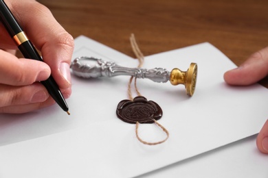 Photo of Male notary working with documents at table, closeup