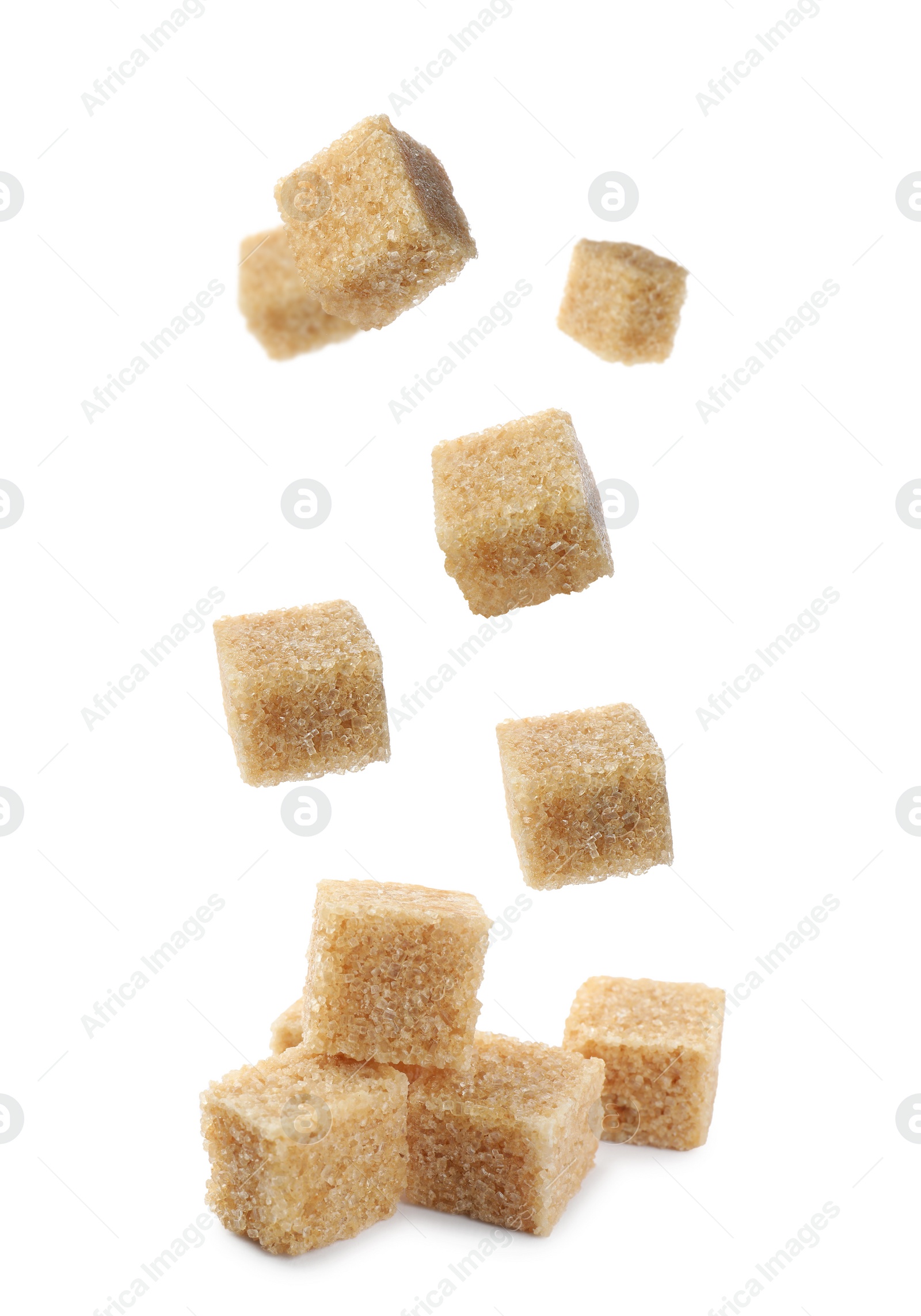 Image of Flying cubes of brown sugar on white background