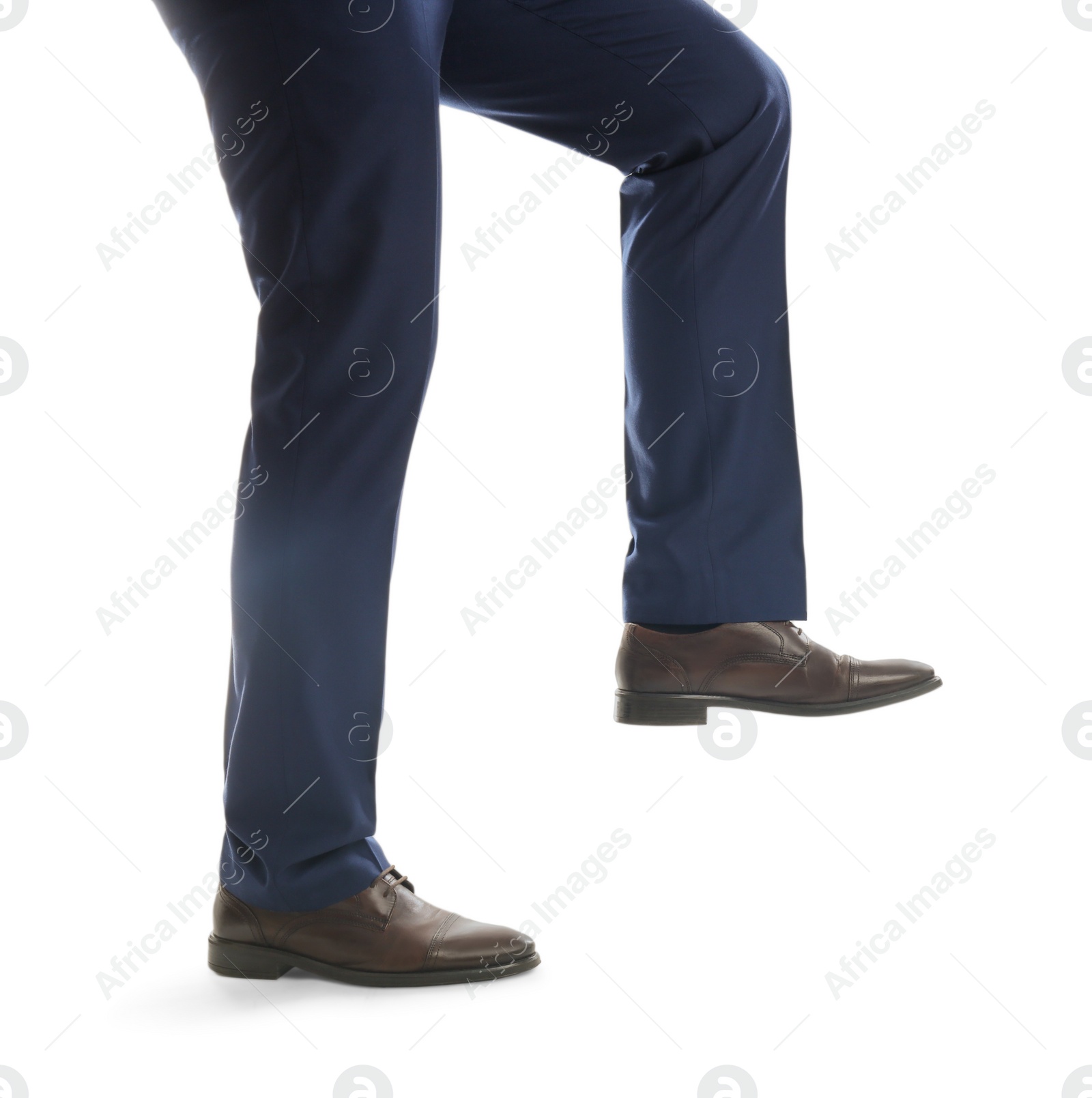 Photo of Businessman imitating stepping up on stairs against white background, closeup. Career ladder concept