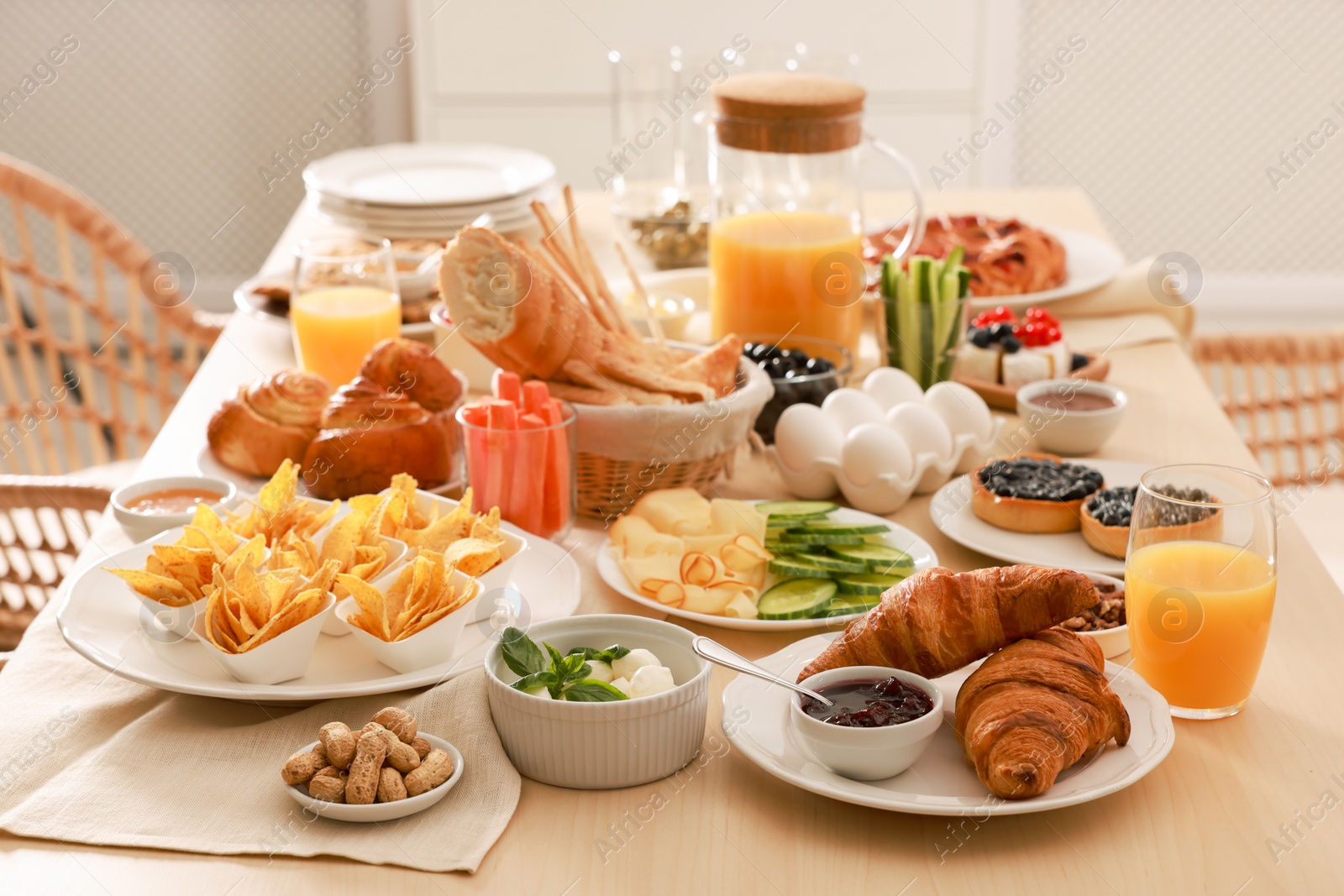 Photo of Dishes with different food on table in room. Luxury brunch