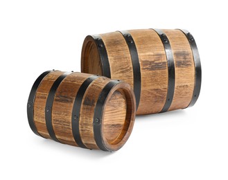 Photo of Two traditional wooden barrels on white background