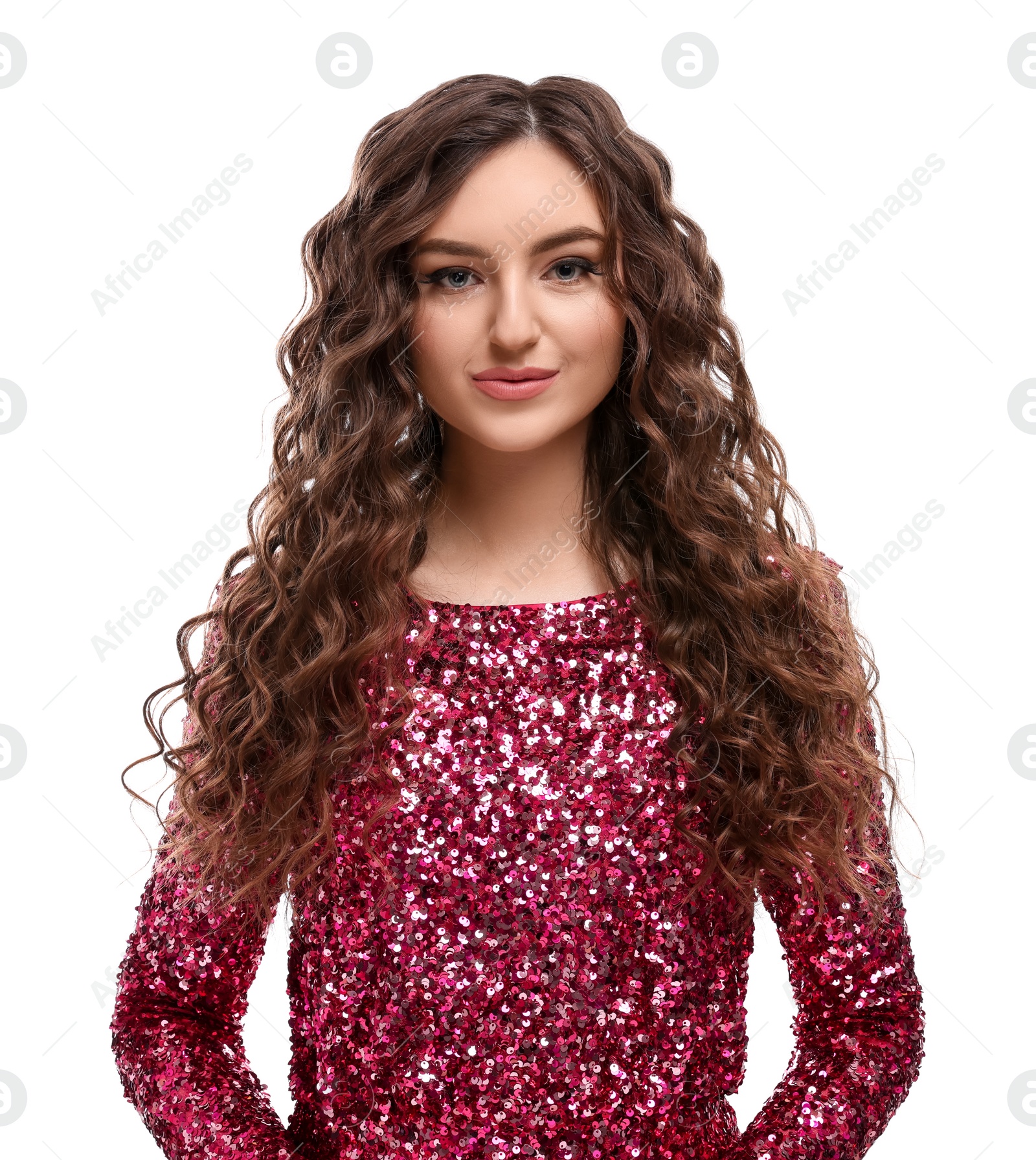 Photo of Beautiful young woman with long curly brown hair in pink sequin dress on white background