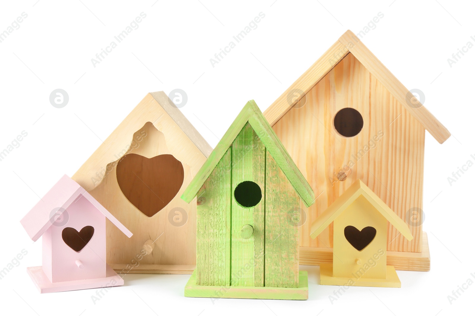 Photo of Many different bird houses on white background