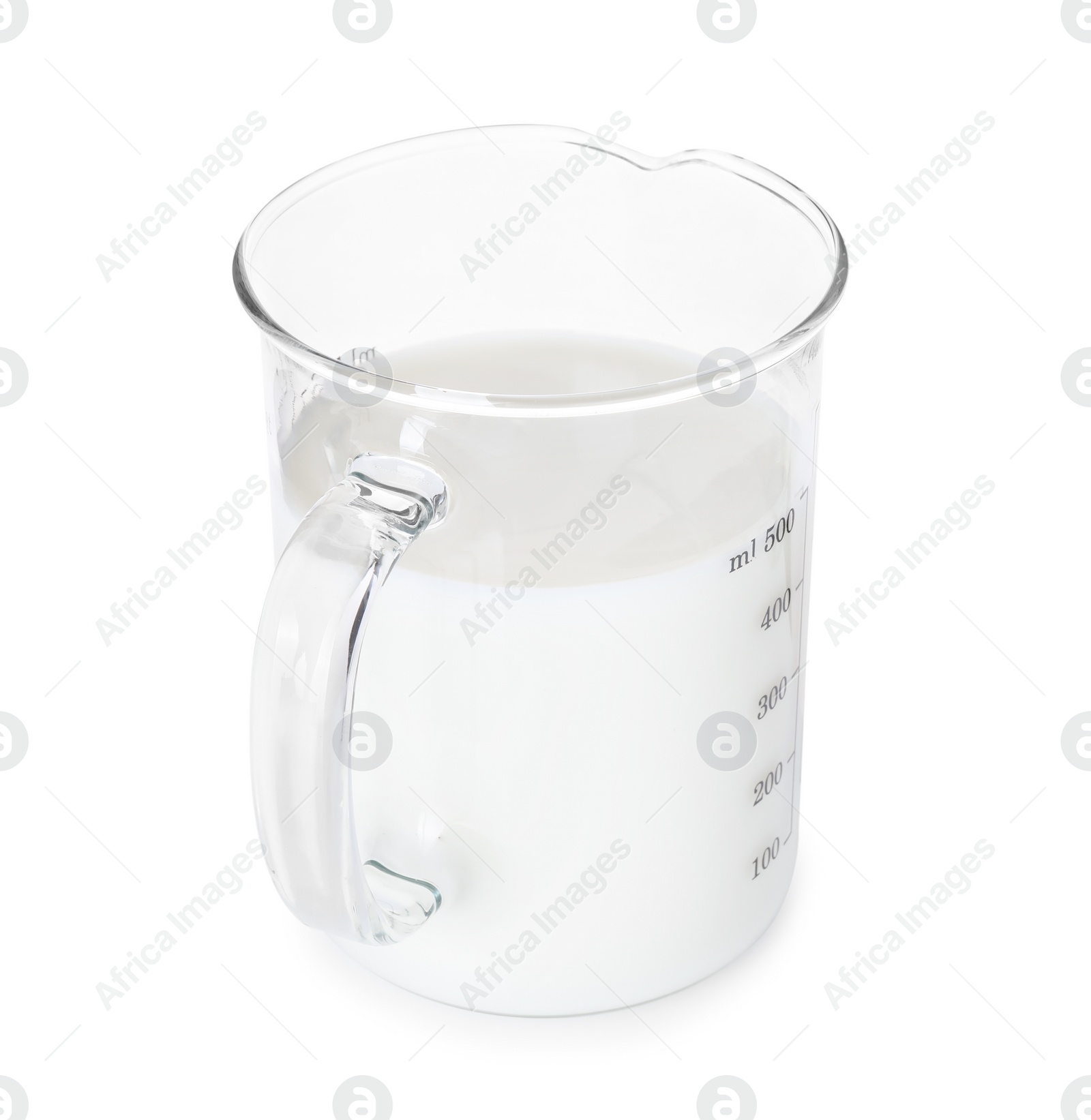 Photo of Fresh milk in measuring cup isolated on white