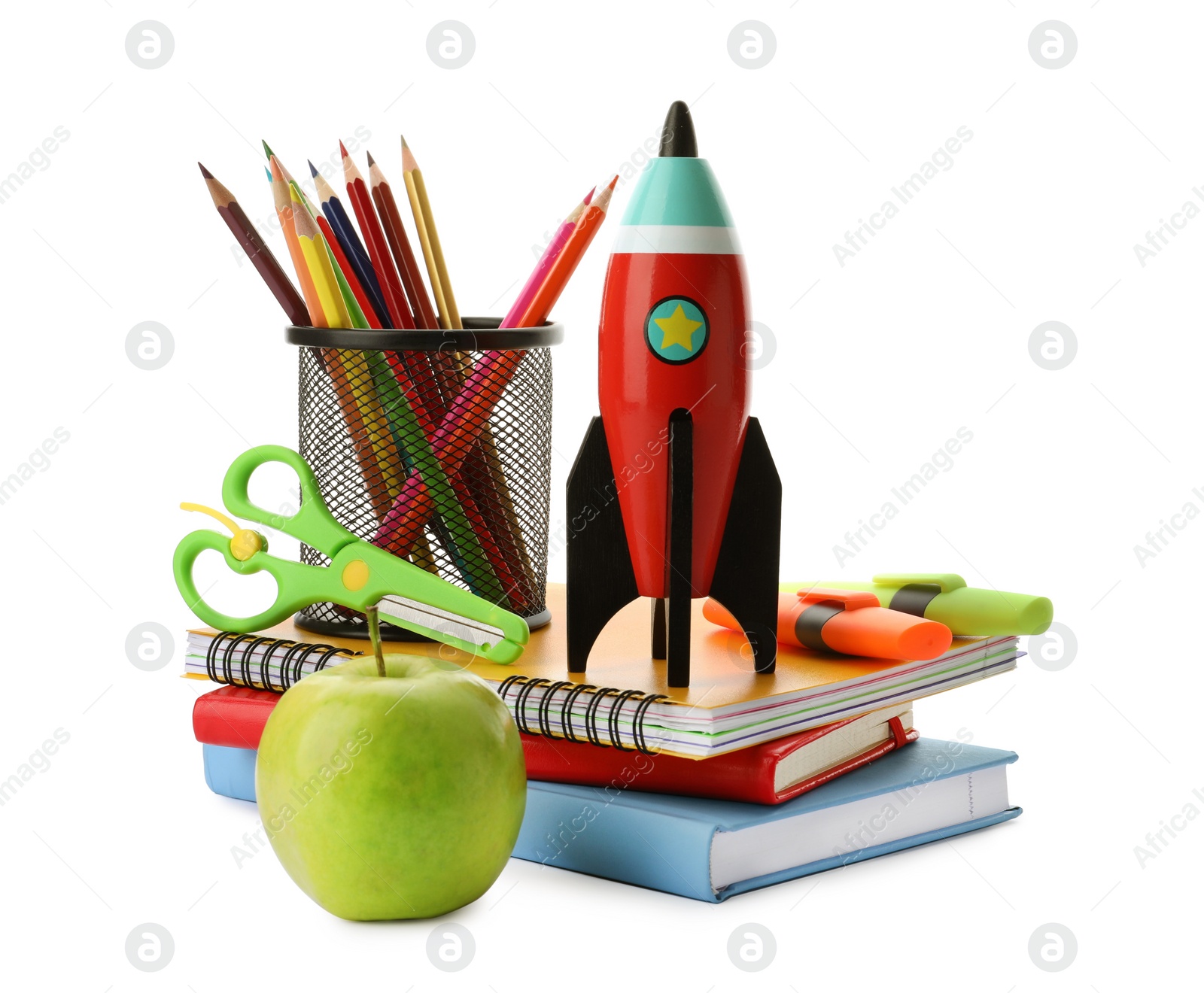 Photo of Bright toy rocket and school supplies on white background