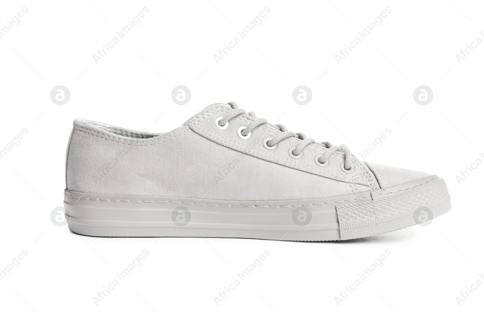 Photo of Stylish sneaker on white background. Trendy footwear