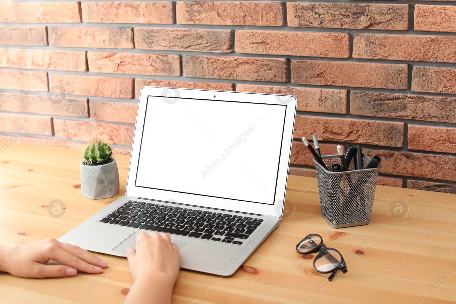 Photo of Woman working with laptop at home. Mock up with space for text