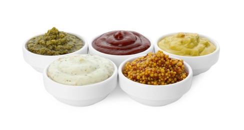 Photo of Many different sauces in bowls on white background