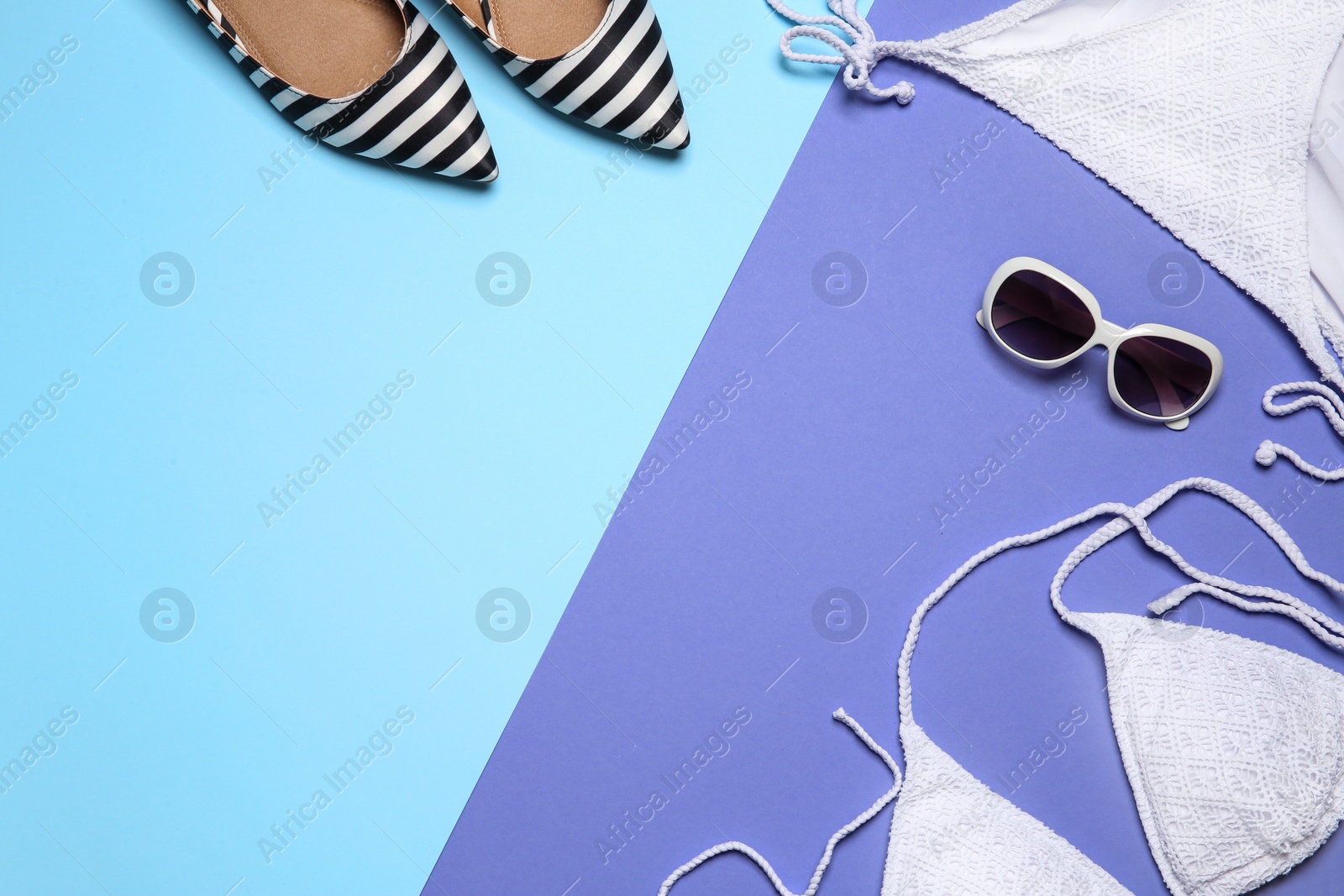 Photo of Flat lay composition with stylish bikini on color background. Space for text