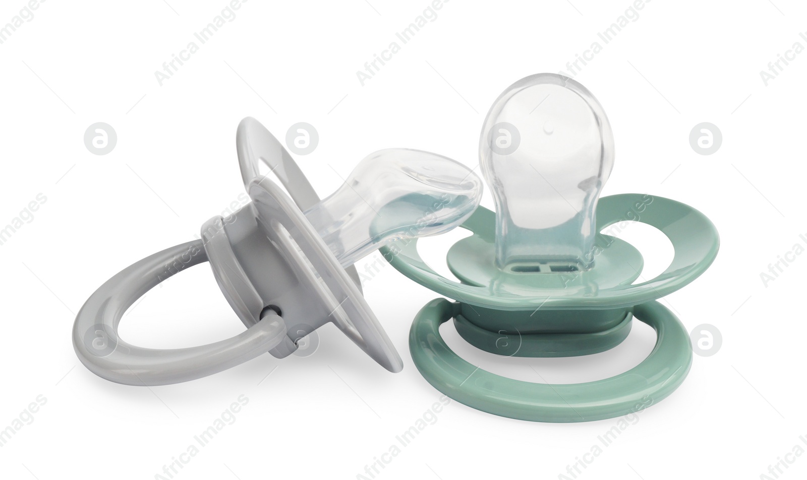 Photo of New different baby pacifiers on white background