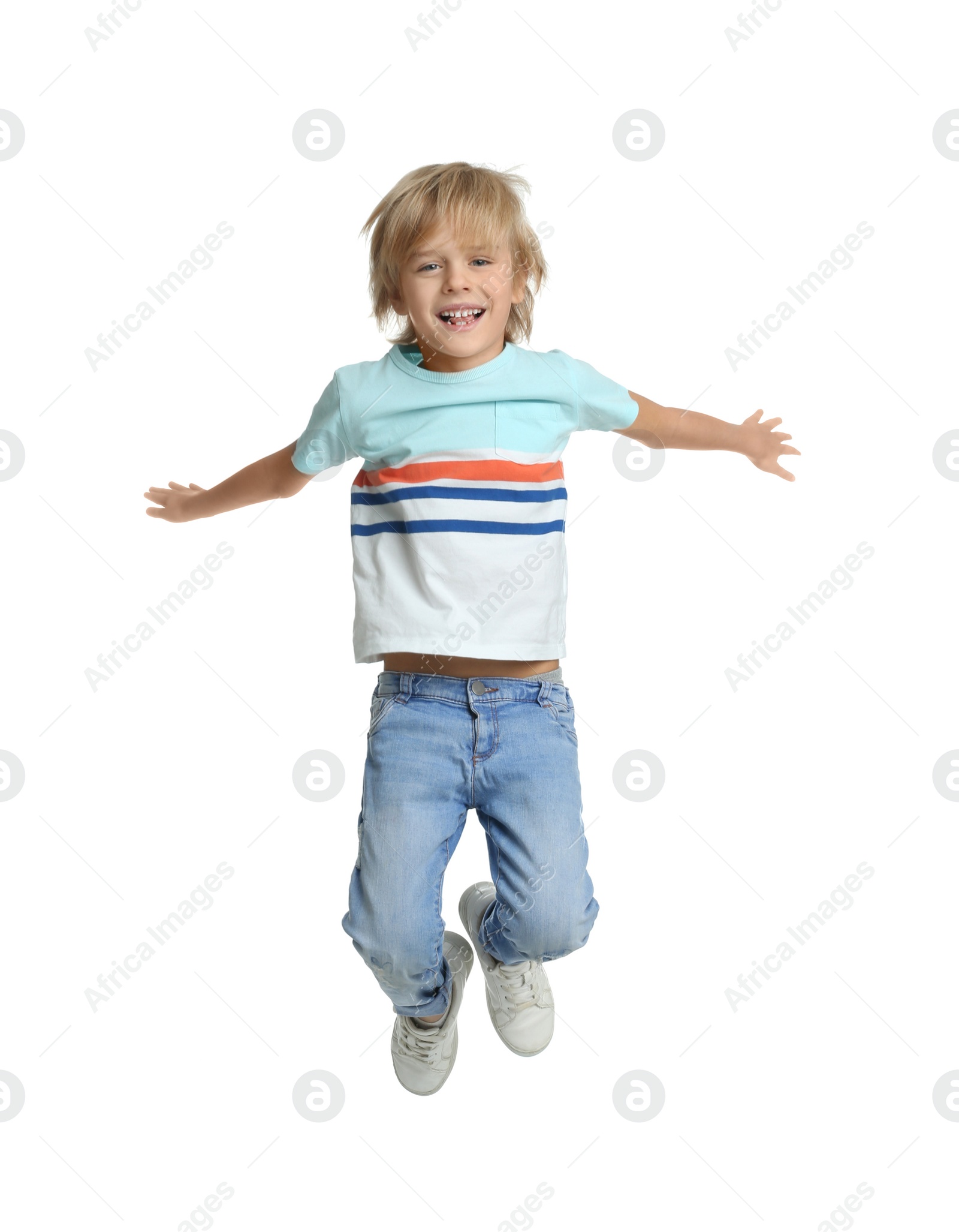 Photo of Happy little boy jumping on white background