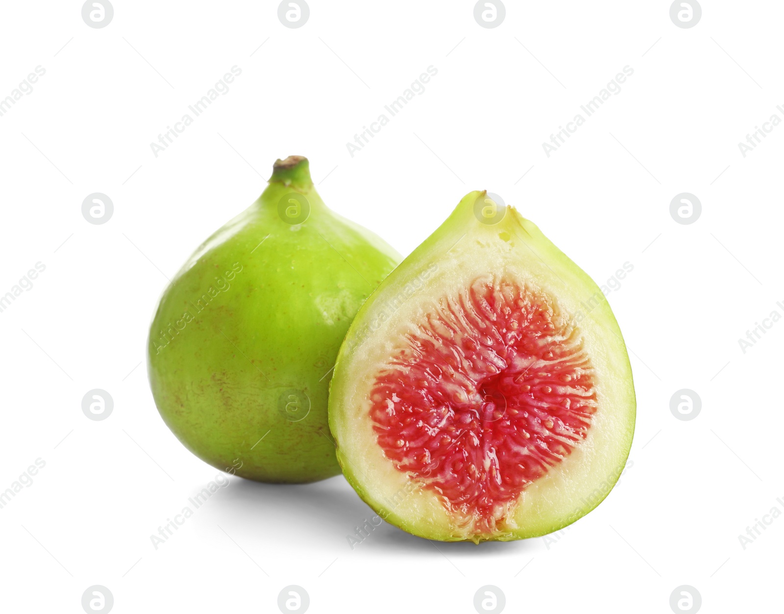 Photo of Whole and cut green figs on white background