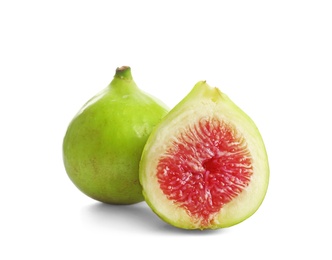 Photo of Whole and cut green figs on white background