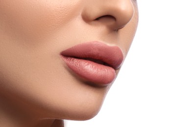 Image of Woman with beautiful lips after permanent makeup procedure on white background, closeup