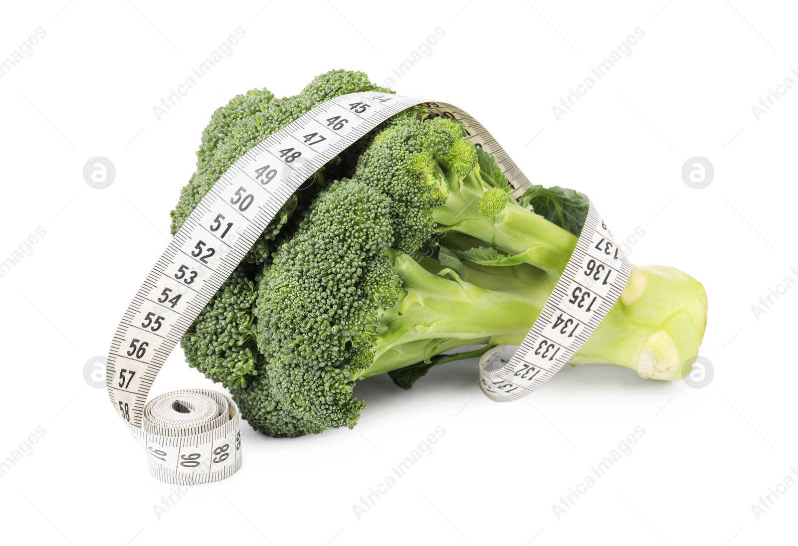 Photo of Healthy diet. Broccoli with measuring tape isolated on white