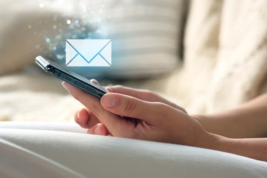 Email. Woman using mobile phone indoors, closeup. Letter illustration over device