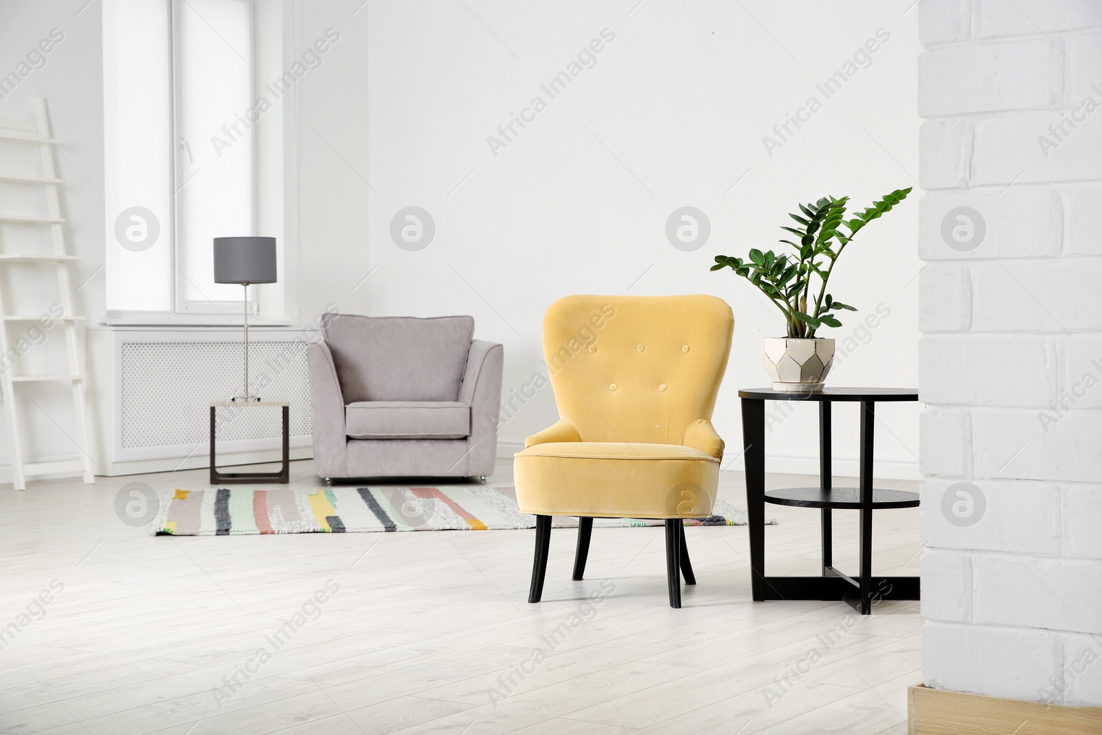 Photo of Elegant room interior with stylish comfortable armchairs