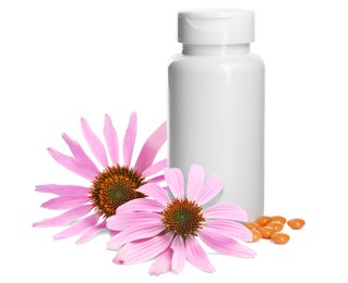 Bottle with vitamin pills and beautiful echinacea flowers on white background