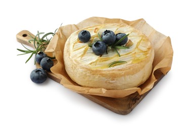 Tasty baked brie cheese with rosemary and blueberries isolated on white