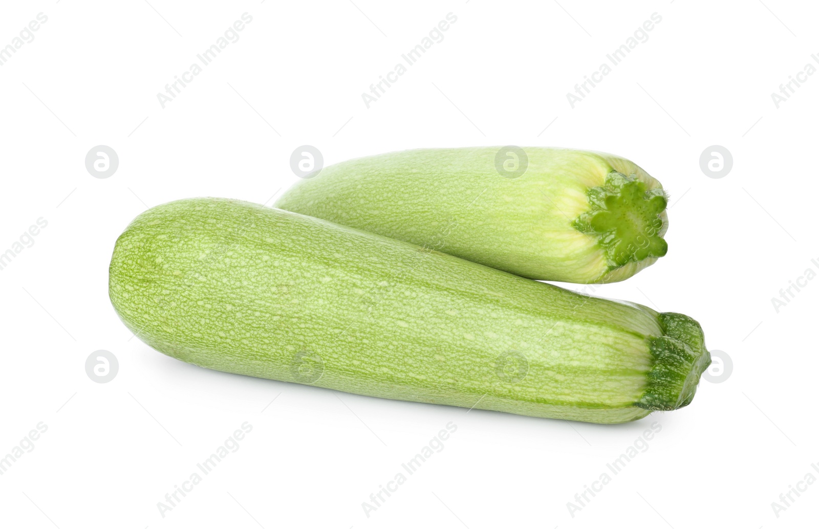 Photo of Raw green ripe zucchinis isolated on white