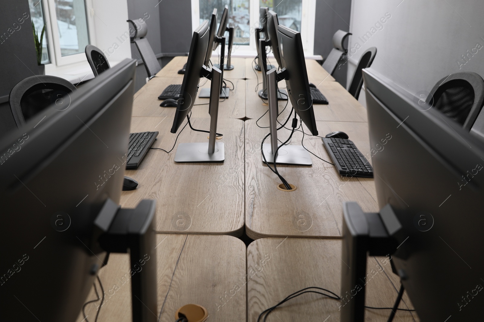 Photo of Many modern computers in open space office