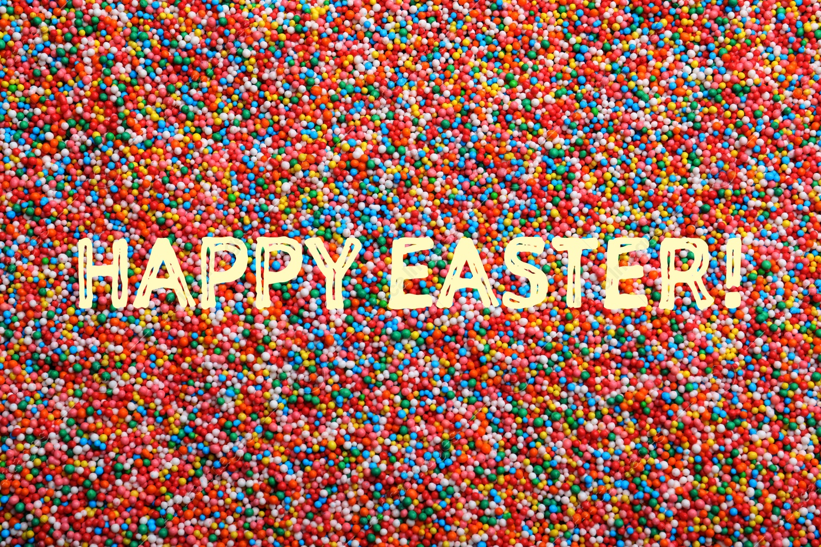 Image of Text Happy Easter and bright colorful sprinkles as background, top view. Confectionery decor