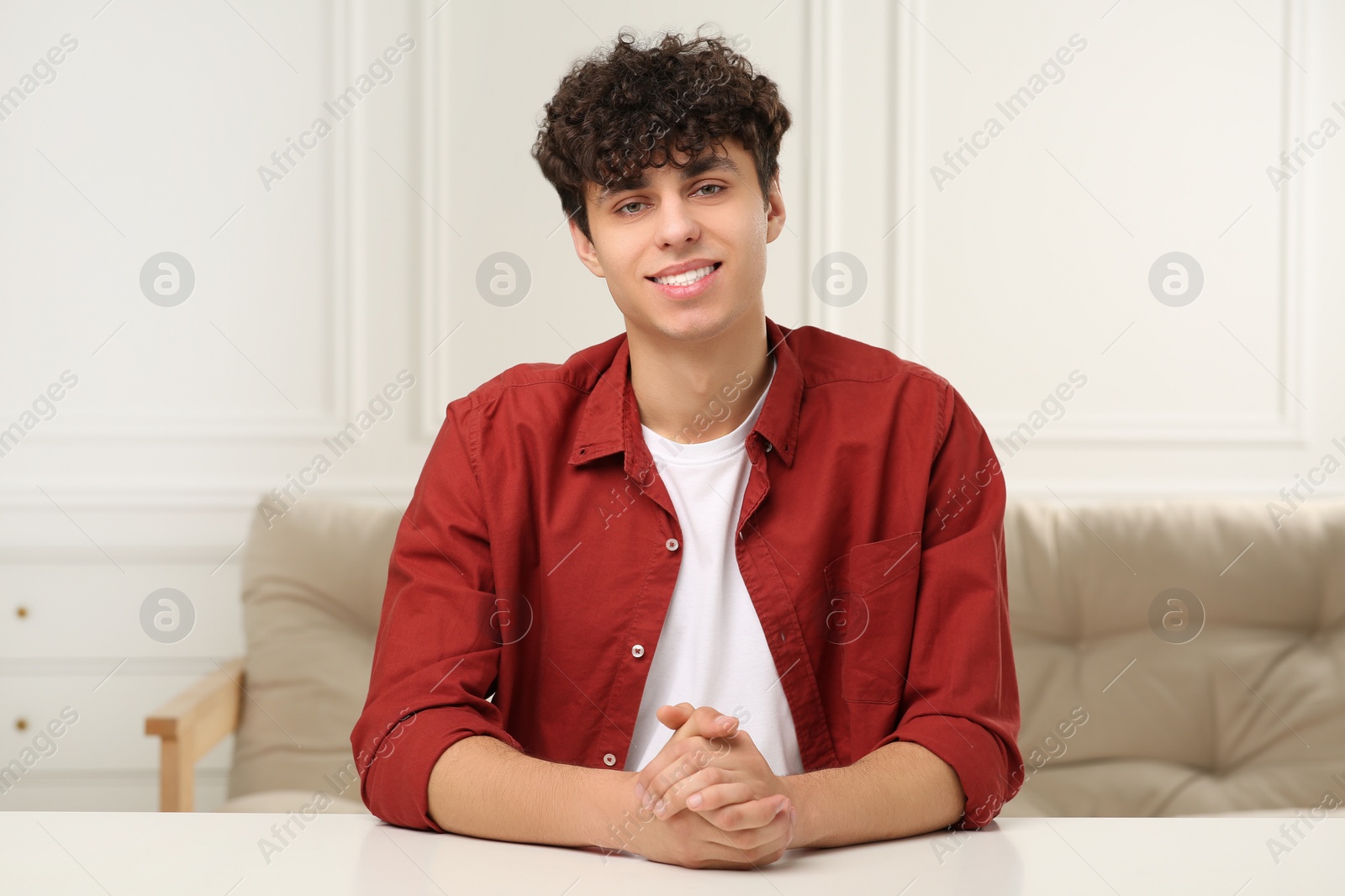 Photo of Young man having online video call at home, view from web camera