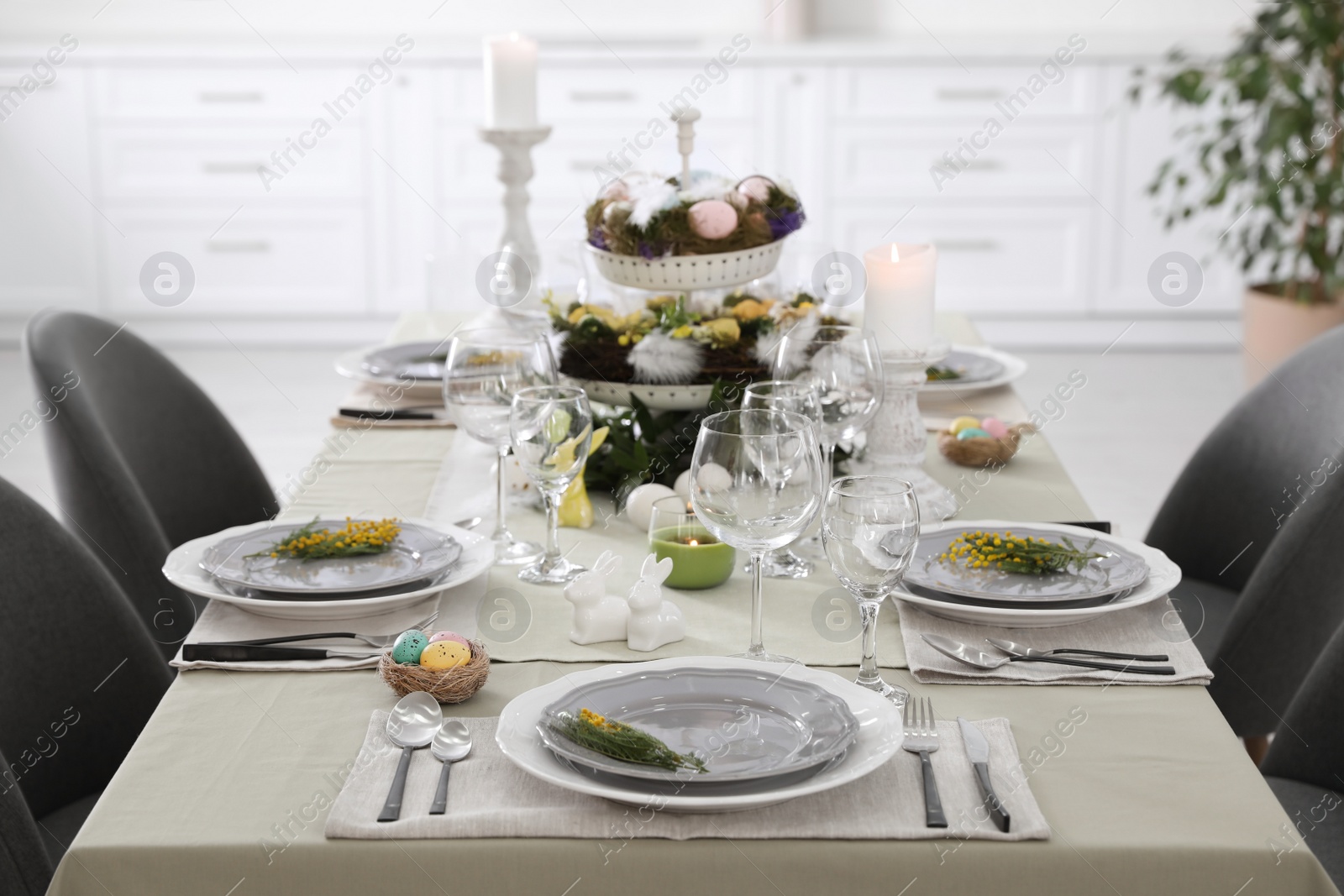 Photo of Beautiful Easter table setting with floral decor indoors