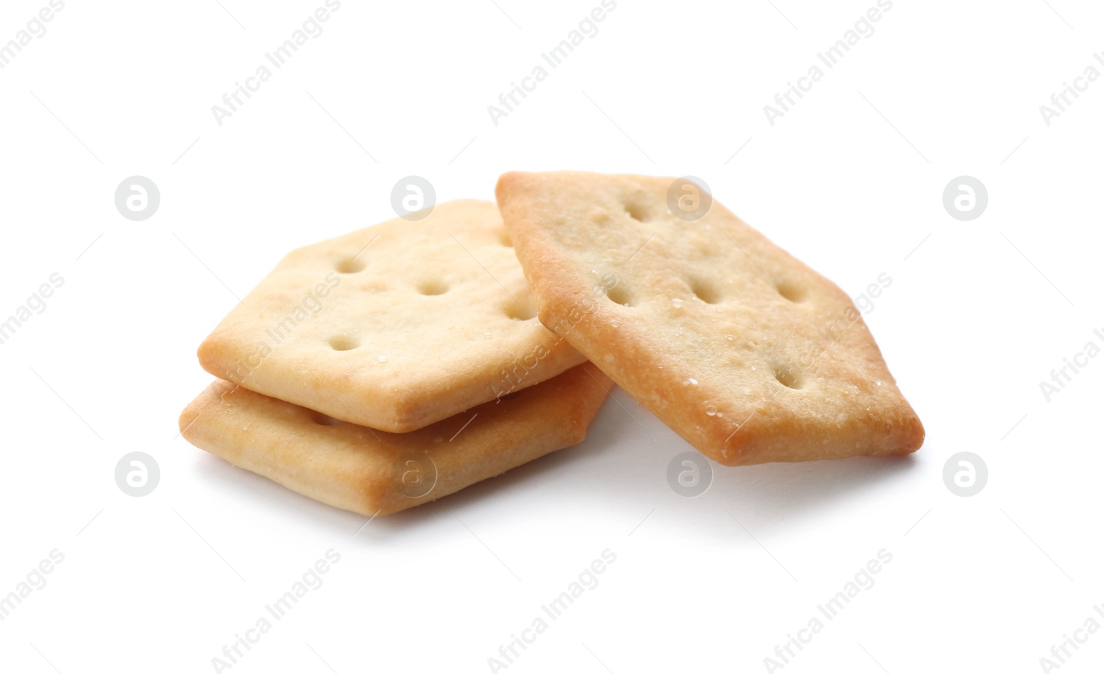 Photo of Crispy crackers isolated on white. Delicious snack