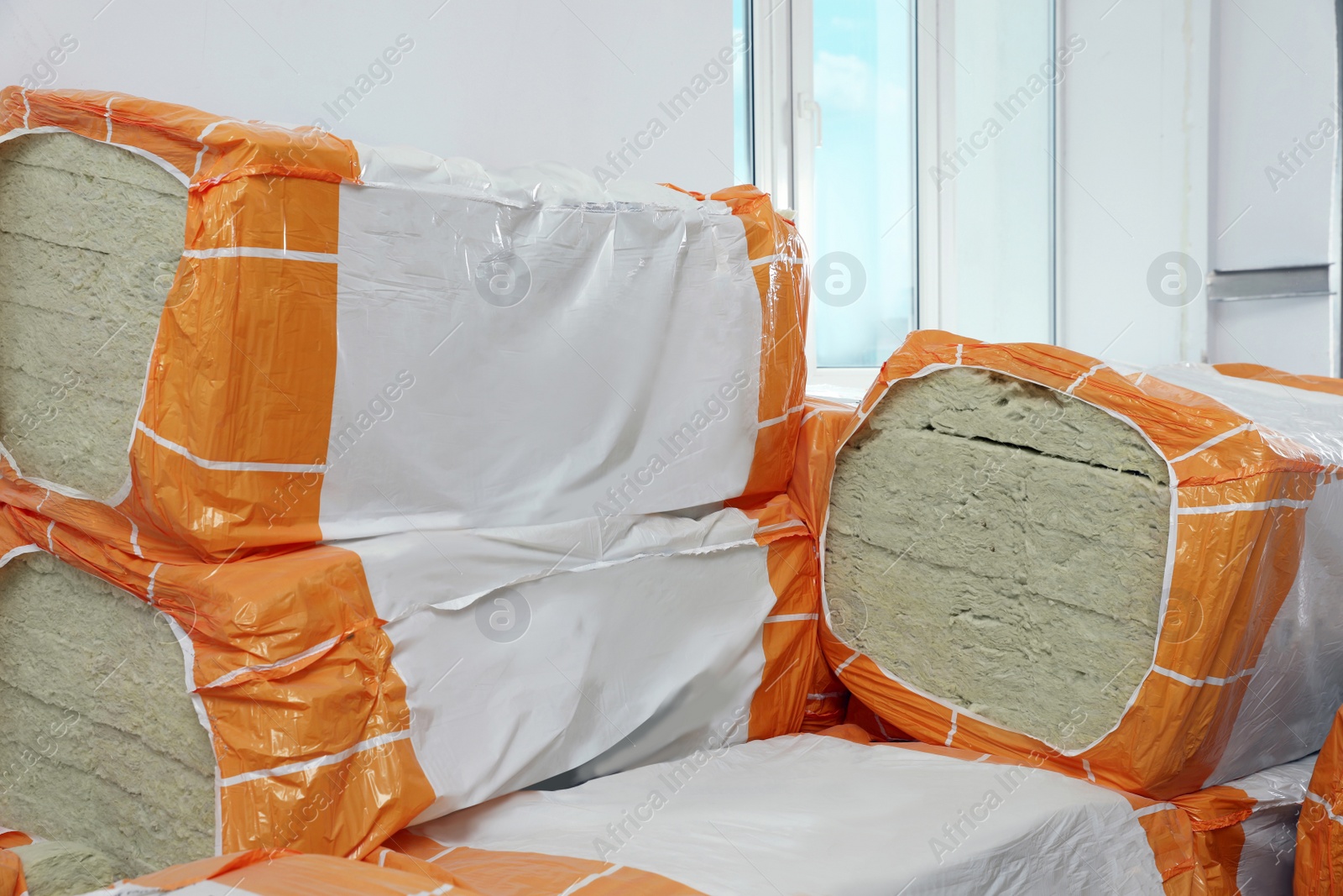 Photo of Packages of thermal insulation material in room