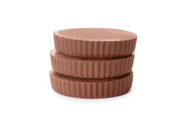Delicious peanut butter cups on white background