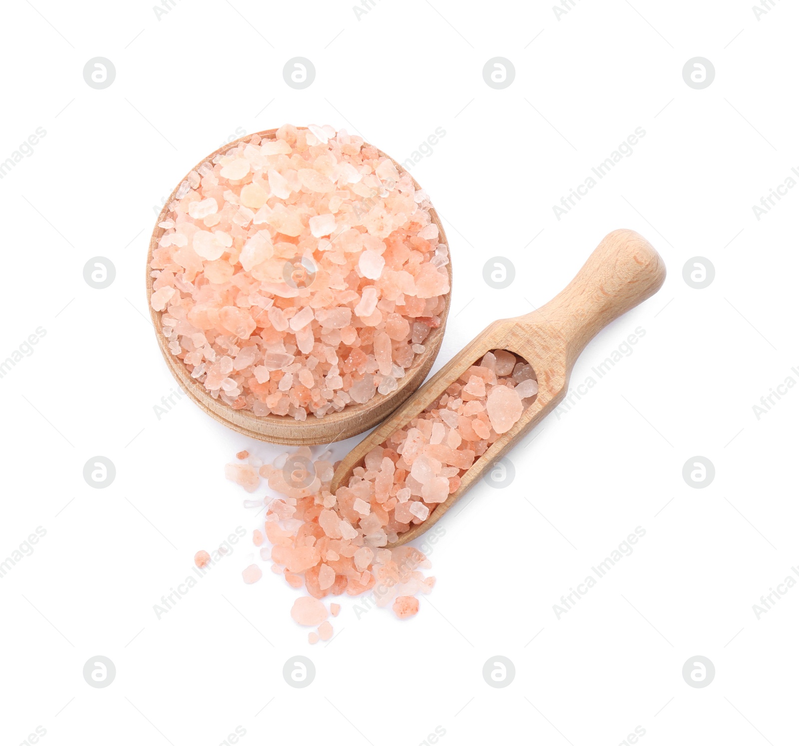 Photo of Bowl and scoop with pink himalayan salt on white background, top view