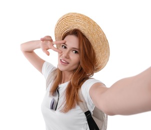 Photo of Beautiful woman in straw hat taking selfie on white background