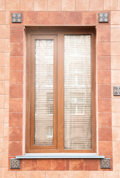 Exterior view of building with modern brown window