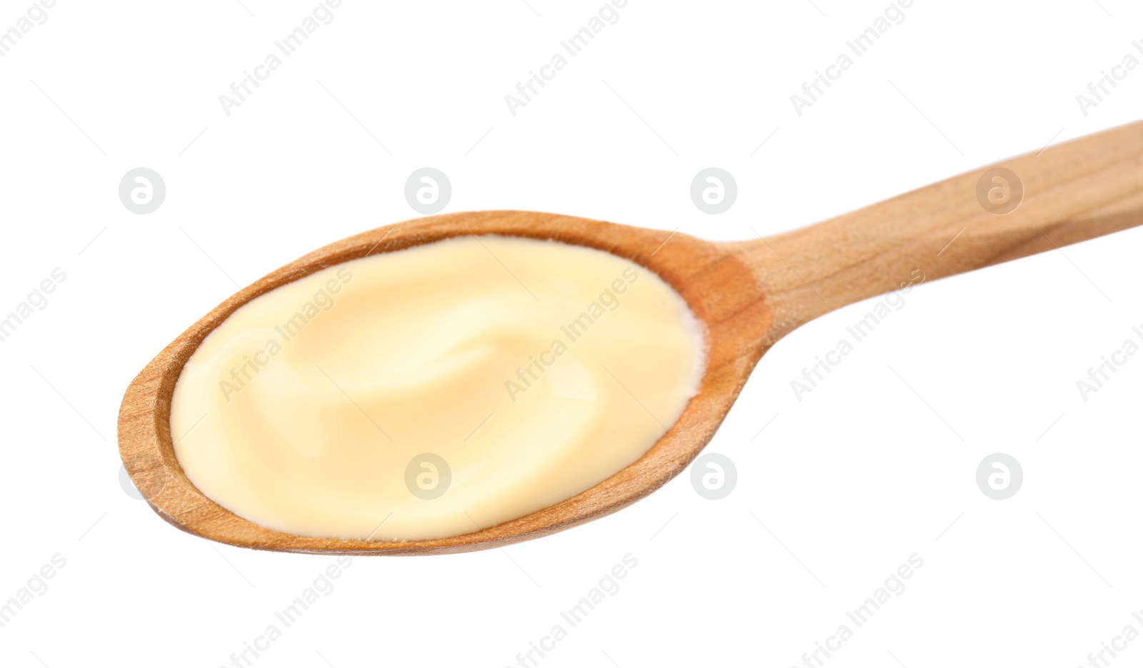 Photo of Wooden spoon with delicious cheese sauce isolated on white