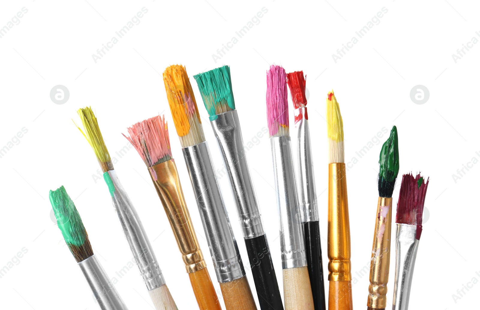 Photo of Different brushes with paints on white background