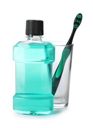 Mouthwash and other items for teeth care on white background