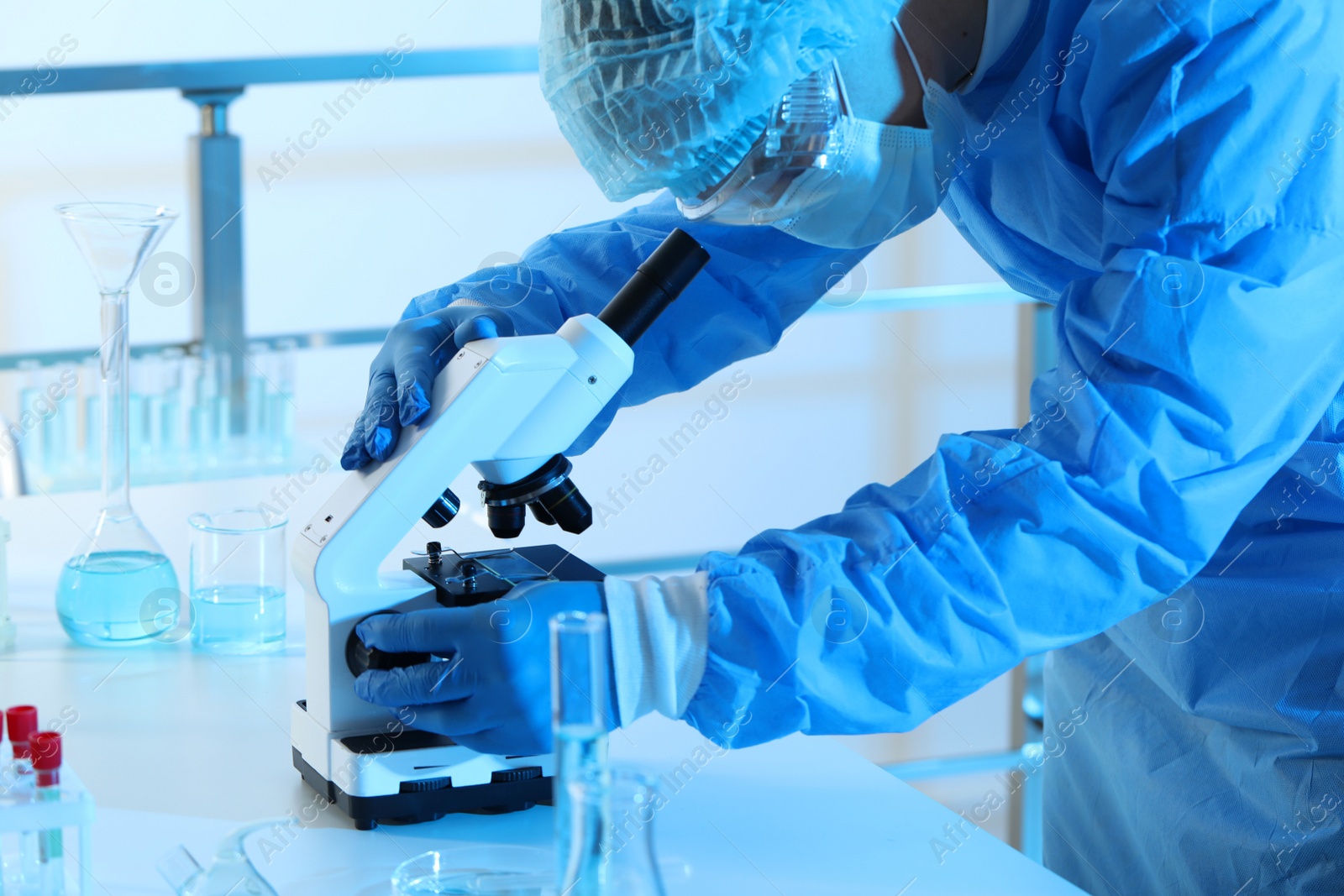 Photo of Scientist working with microscope in laboratory. Medical research